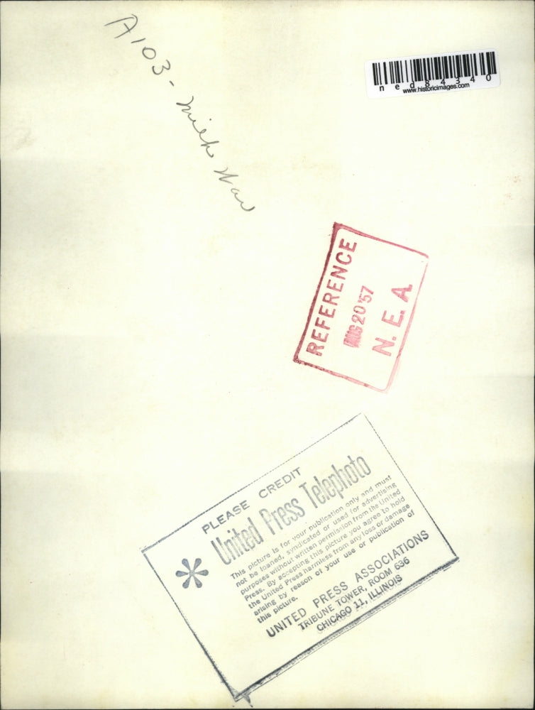 1957 Press Photo Harold L. Blower dumps 1000 pounds of a raw milk down the sewer