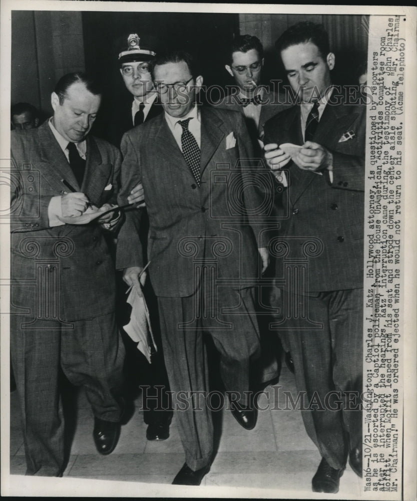 1947 Press Photo Charles Katz, Hollywood lawyer escorted by a Capitol policeman