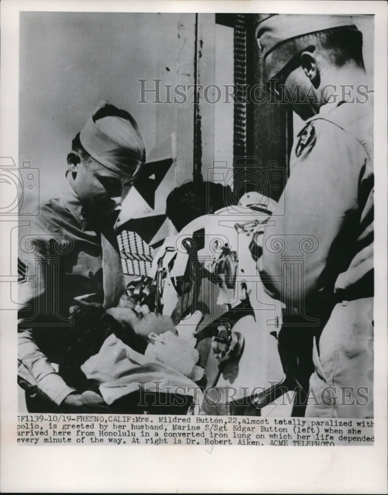 1951 Press Photo Fresno Calif Mrs Mildred Button greeted by her husband Marine - Historic Images