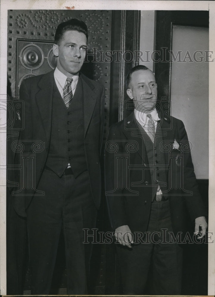 1935 Press Photo Mandeville Zengis is shown above with a Baliff
