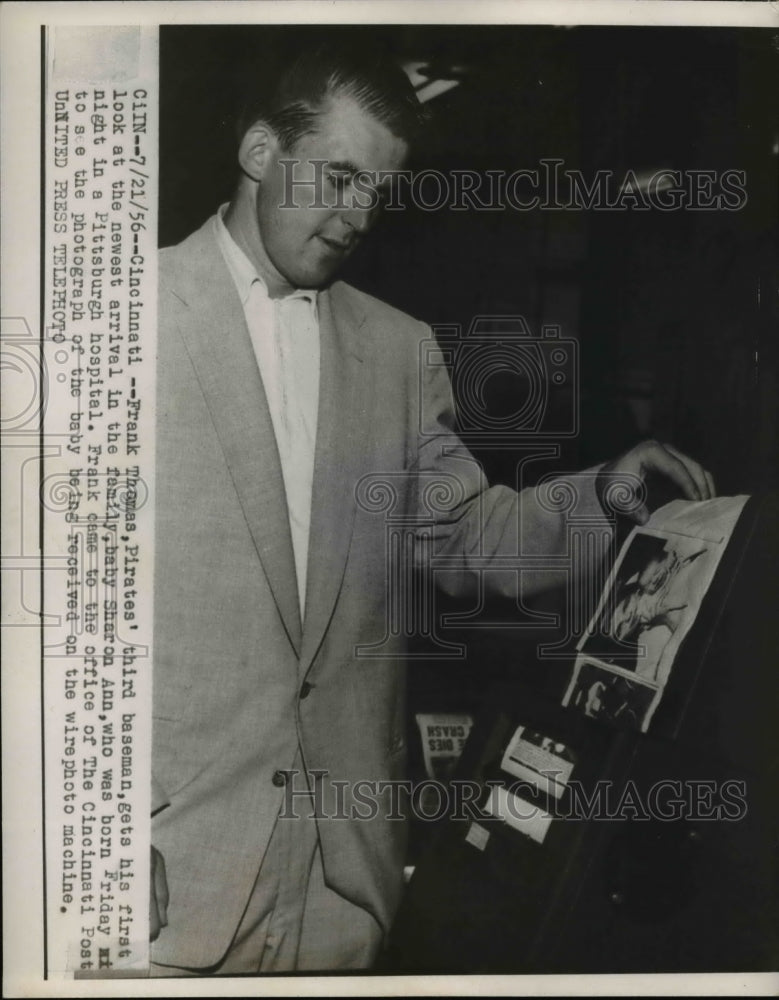 1956 Press Photo Frank Thomas gets his first look at baby Sharon Ann
