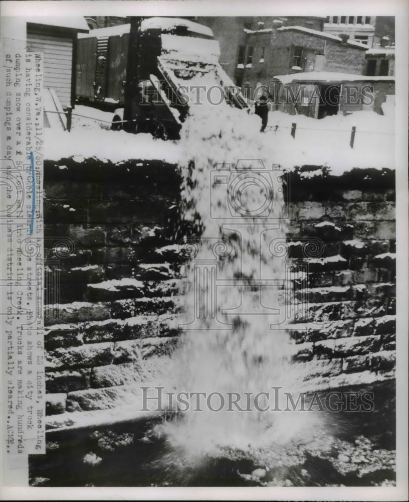 1950 Press Photo Trucks Dump Snow After Massive Snow Fall