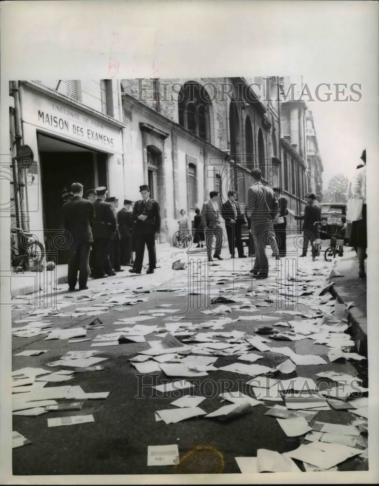 1958 Press Photo Papers Left in Street Outside University of Paris Exam Building