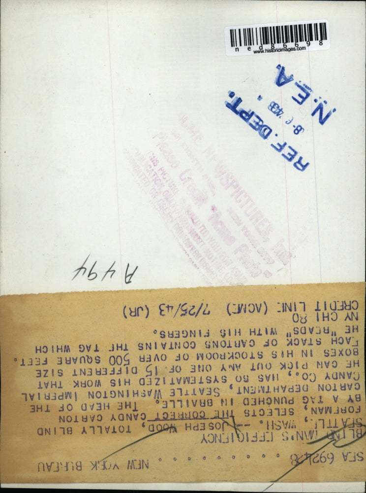 1943 Press Photo Joseph Wood Selecting Candy Carton By Braille Tag