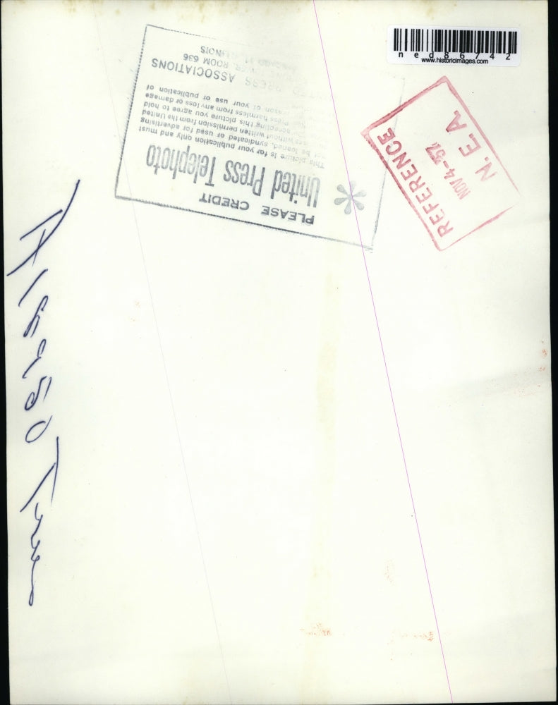 Load image into Gallery viewer, 1957 Press Photo of Joseph Dunn and Lawrence Kunar unloading Christmas trees.
