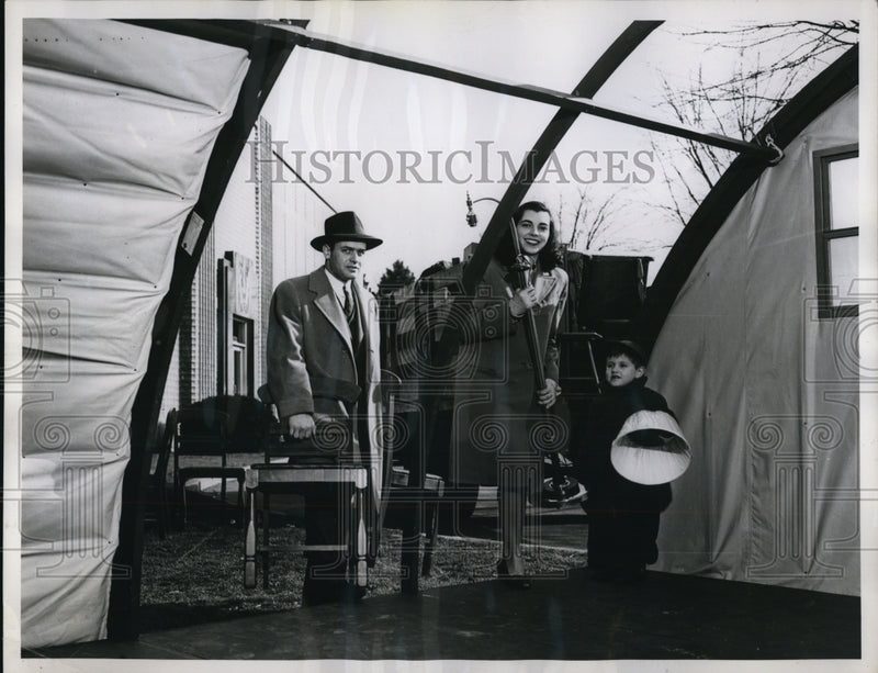 Load image into Gallery viewer, 1946 Press Photo Family Moves in Furniture before Portable Glass House is Done
