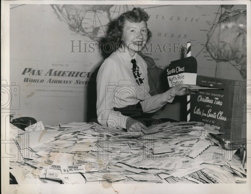 Load image into Gallery viewer, 1953 Press Photo Mrs.Betty Wright sorting mails for Santa
