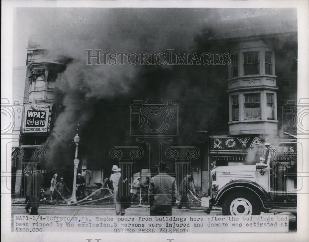 1954 Press Photo Smoke pours from building after the explosion. 3 were injured.