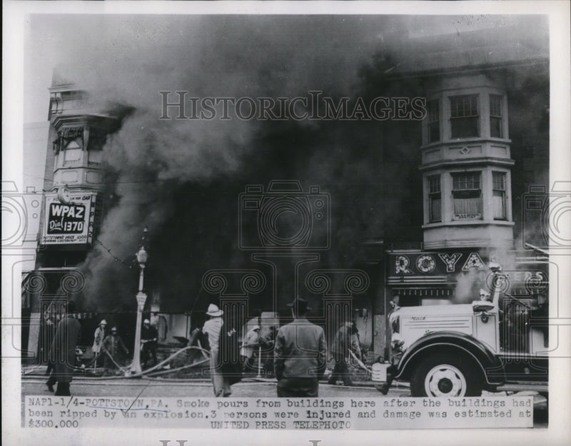 Load image into Gallery viewer, 1954 Press Photo Smoke pours from building after the explosion. 3 were injured.
