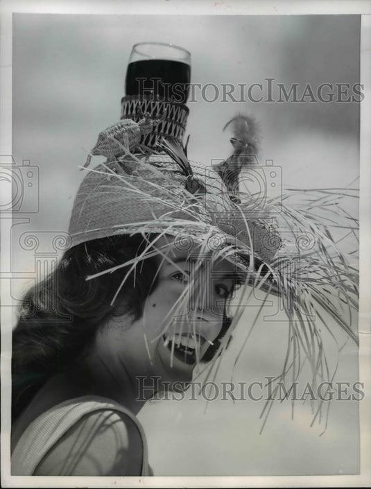 1956 Press Photo of Jo Tapley wearing a fringed beach hat.