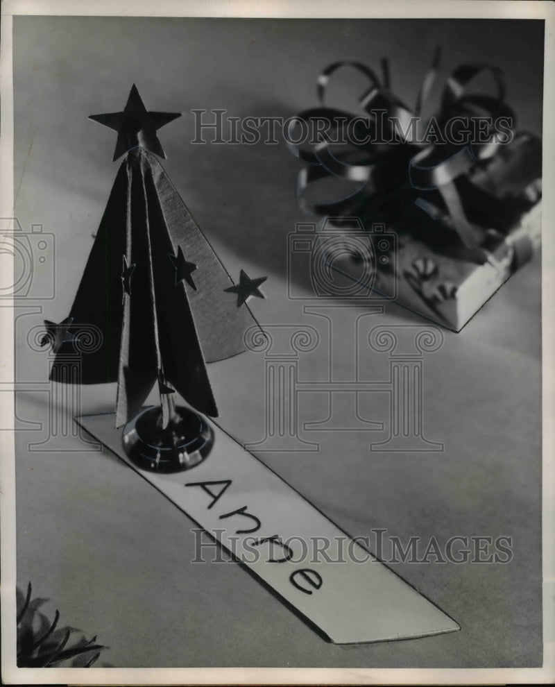 Load image into Gallery viewer, 1952 Press Photo of name tag for a Christmas present.

