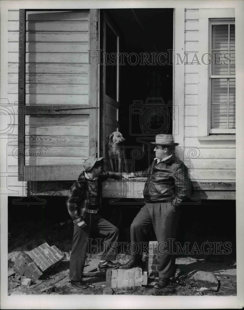 Load image into Gallery viewer, 1952 Press Photo Jack Seymour and stepson Martin Glover standing with the dog
