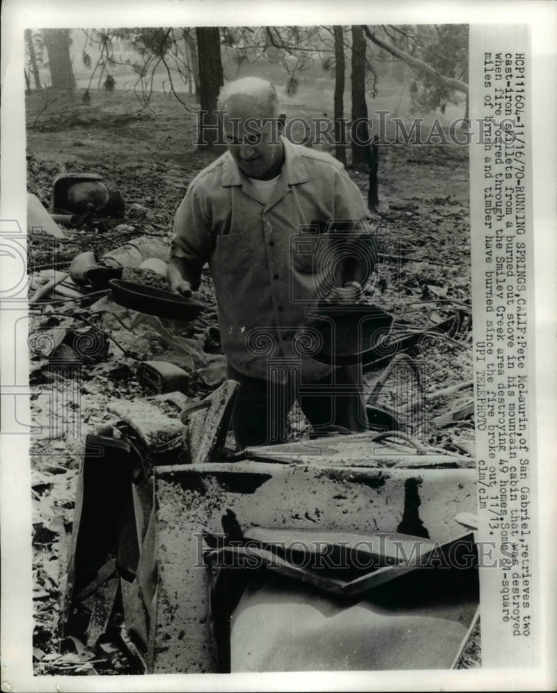 Load image into Gallery viewer, 1970 Press Photo Pete McLaurin Retrieves Two Cast Iron From a Burned Out Stove
