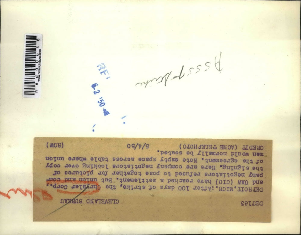 1950 Press Photo Company negotiators looking of copy of agreement