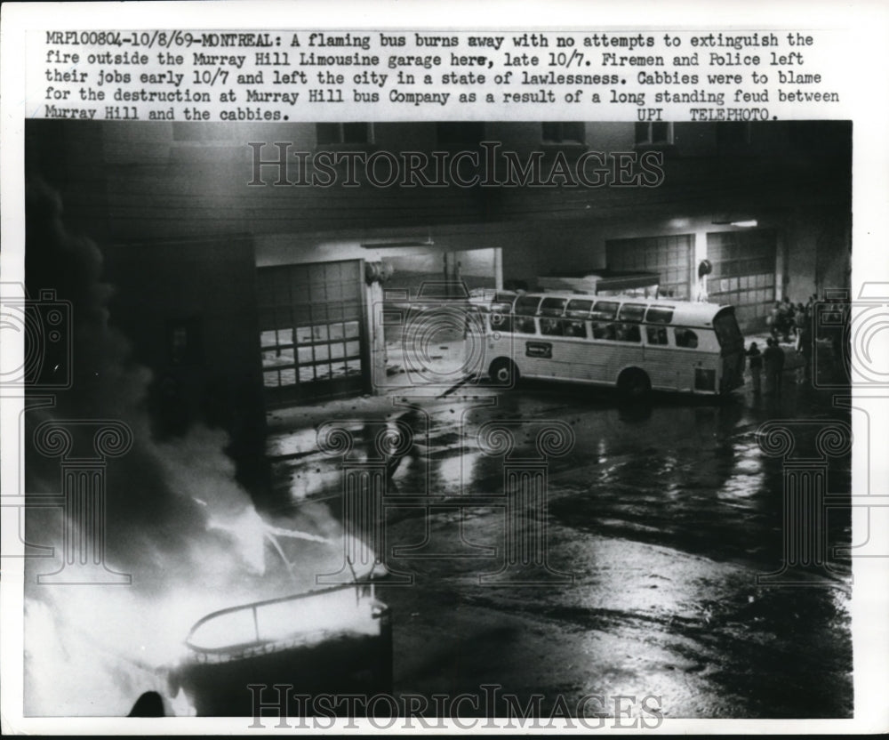 1969 Press Photo Flaming bus by cabbies in Montreal