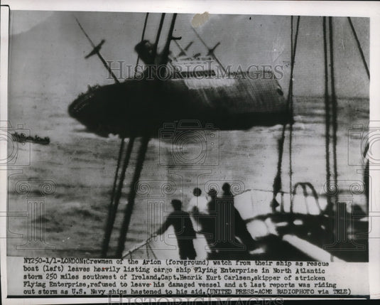 1952 Press Photo of crewmen watching a heavily listing cargo ship the Flying
