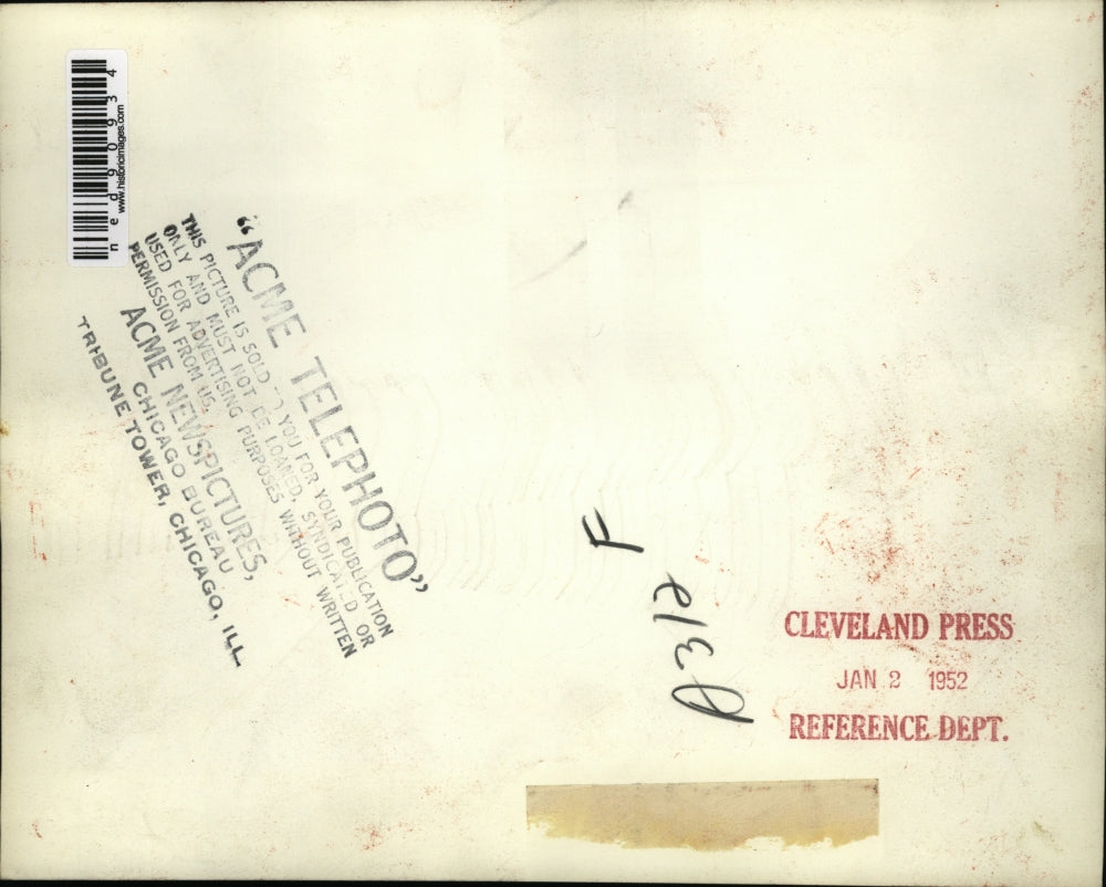 1952 Press Photo of crewmen watching a heavily listing cargo ship the Flying