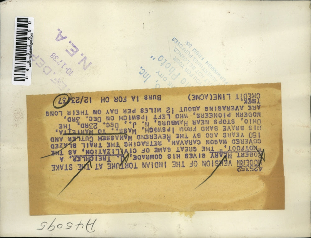 1937 Press Photo of Robert Neary giving his comrade, J, Triechler a hotfoot