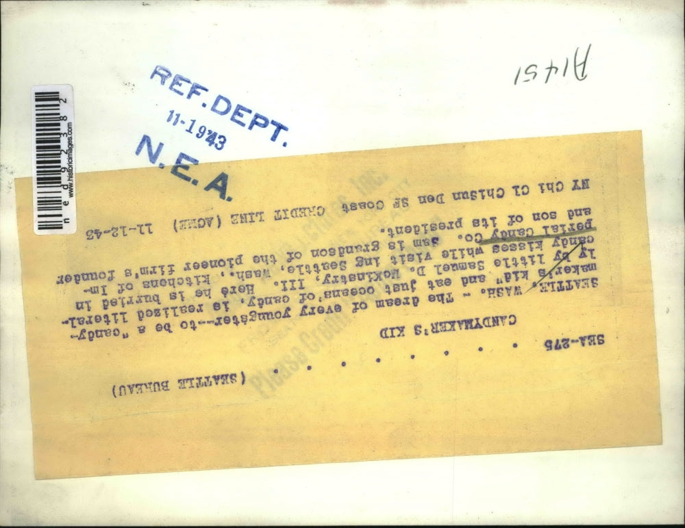 1943 Press Photo Samuel D. McKinstry III is buried in candy.