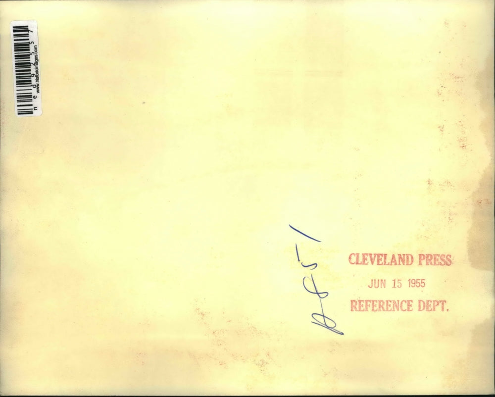 1955 Press Photo of a man taking down the Papal flag from the Congress