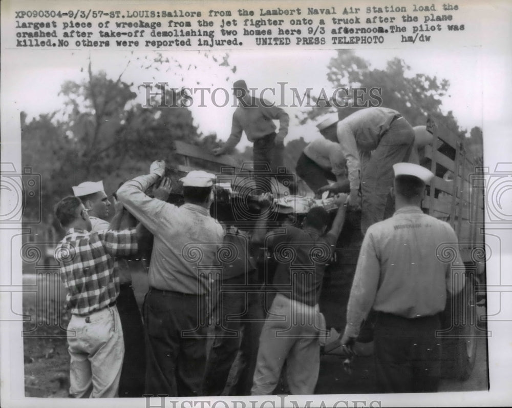 1957 Press Photo Sailors from Lambert Naval Air Station with a jet wreckage