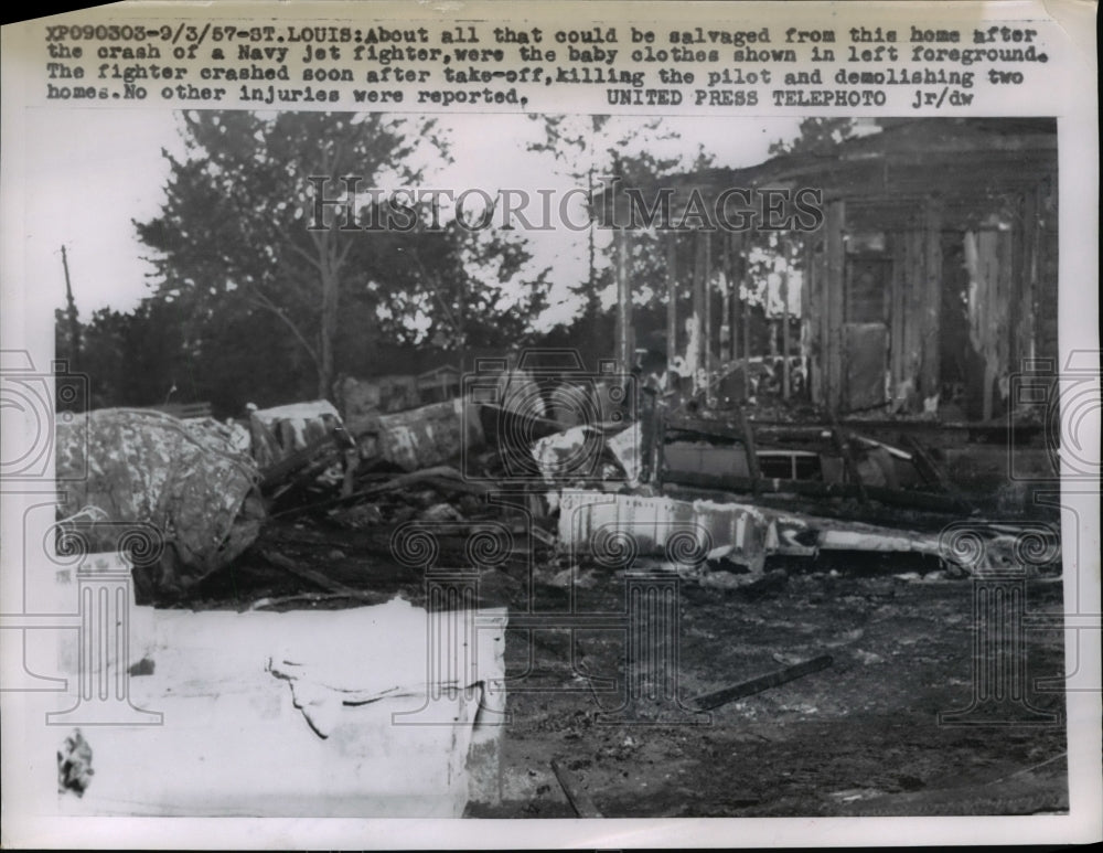 1957 Press Photo Wreckage of a jet fighter crashing into several houses