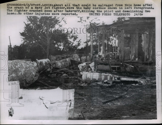 1957 Press Photo Wreckage of a jet fighter crashing into several houses