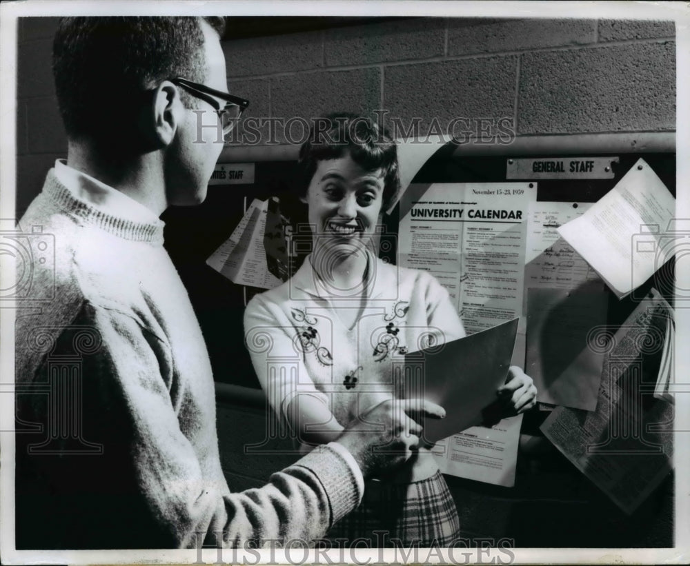1960 Press Photo The office cartoonist passes a panel to Phoebe A Kosfield