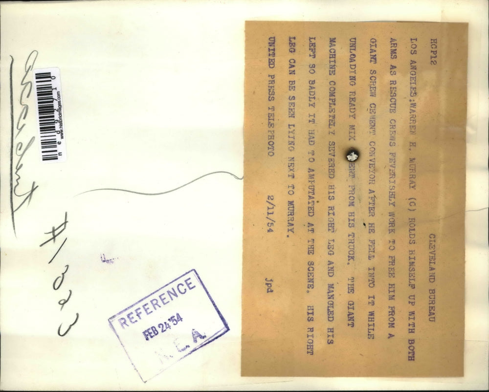 1954 Press Photo Warren Murray holds himself up while rescuers work to free him