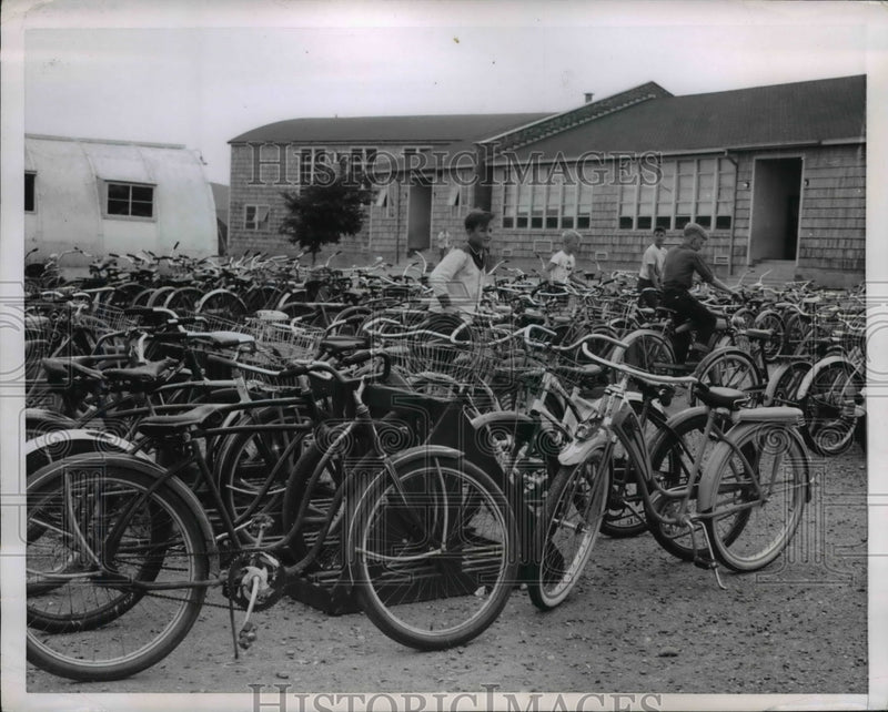 Load image into Gallery viewer, 1954 Press Photo Several bikes at the American School yard
