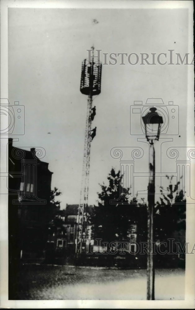 1943 Press Photo of tower in Belgium during WWII with a Union Jack on top.