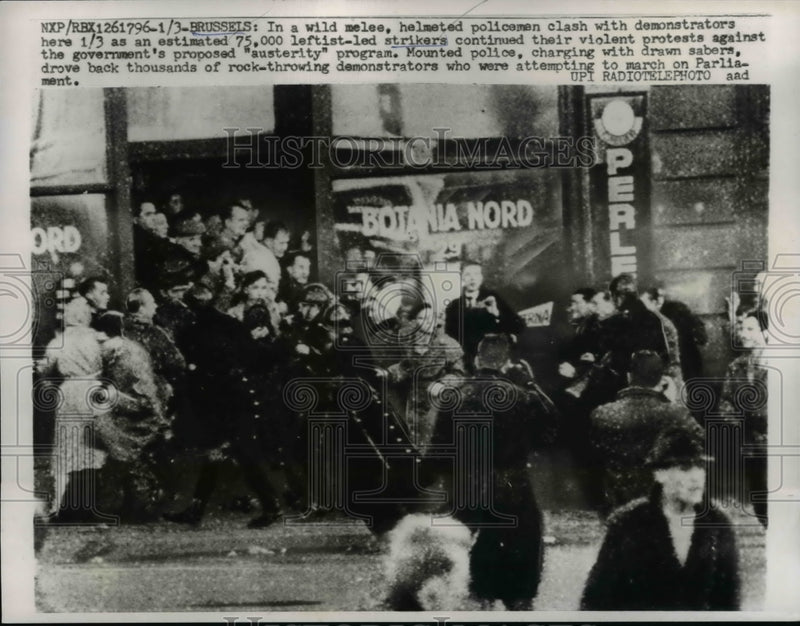 Load image into Gallery viewer, 1961 Press Photo of helmeted policemen clashing with leftist strikers in Belgium

