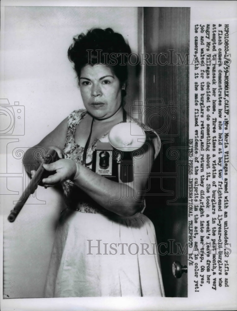 Load image into Gallery viewer, 1959 Press Photo Mrs.Maria Villegas armed with an unloaded .22 rifle
