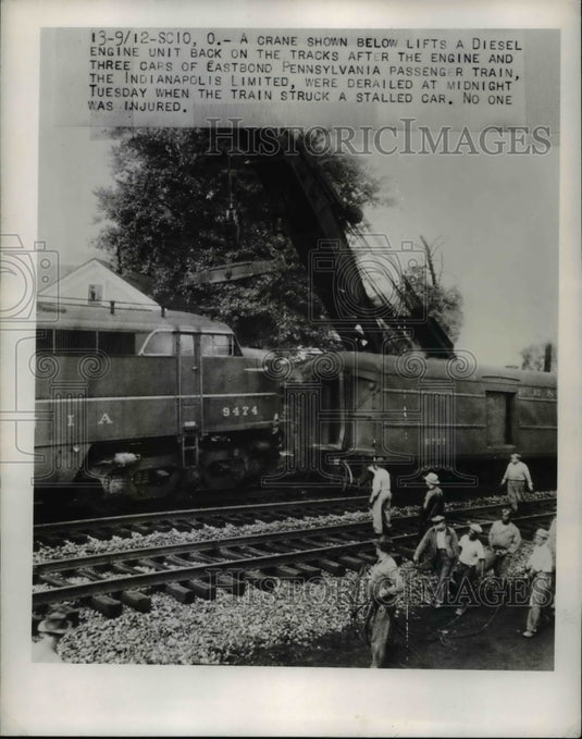 1950 Press Photo Crane Lifts Diesel Train Engine Indianapolis Limited onto Track