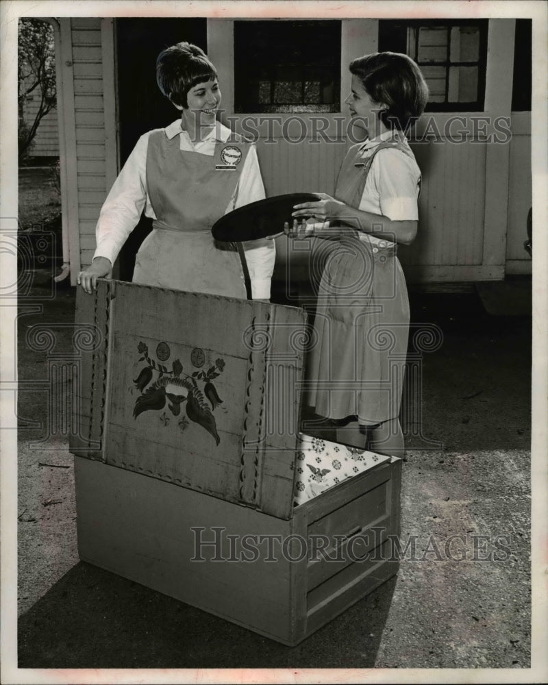 Load image into Gallery viewer, 1970 Press Photo Women Bargaining Over Household Chest Items
