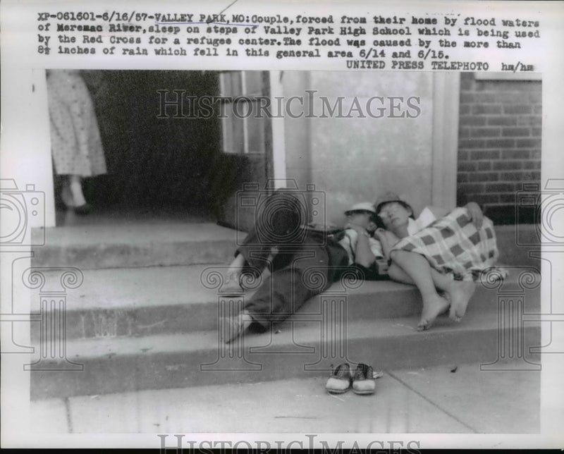 Load image into Gallery viewer, 1957 Press Photo Couple Forced Out Due to Flood SLeep on School Steps Missouri
