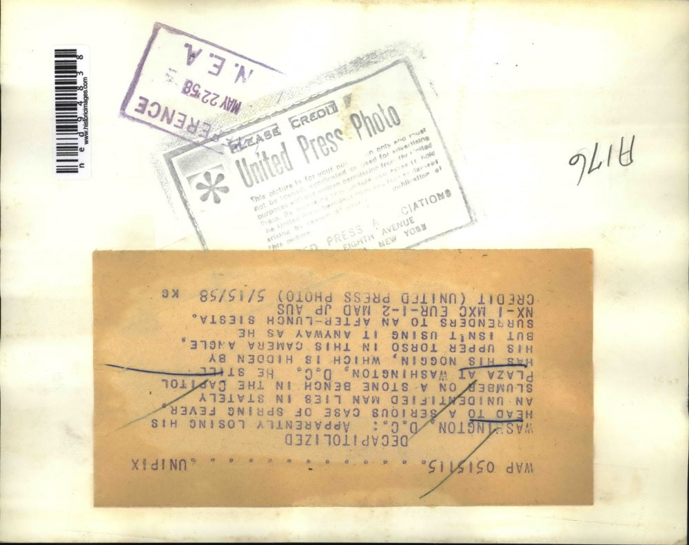 1958 Press Photo A man taking a nap on a bench in the Capital Plaza - ned94838