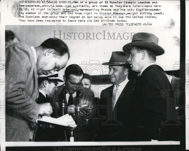 Load image into Gallery viewer, 1956 Press Photo Group of 18 Russian Olympic coaches &amp; newspapermen in L.A
