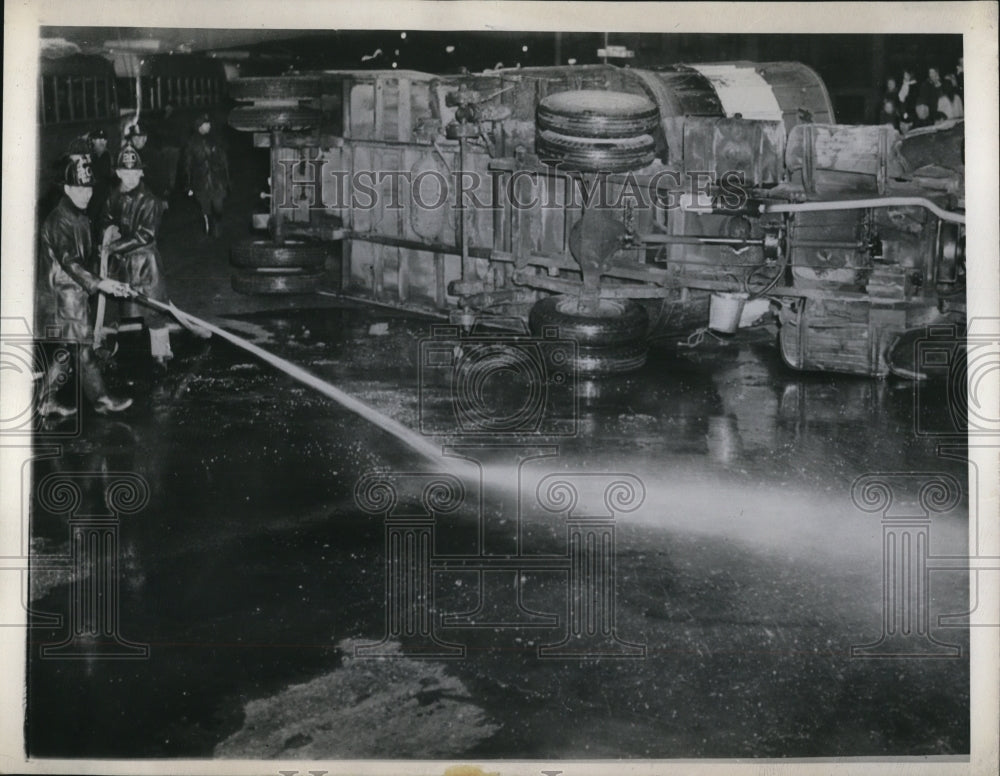 1946 Press Photo Milwaukee Wis firemen at overturned gas tanker truck