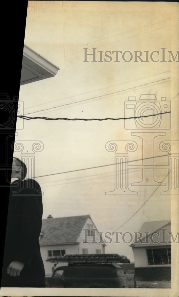 1958 Press Photo Shiver checking a three-wire service for standards