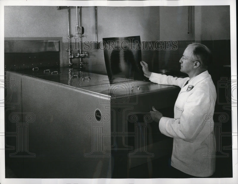 Load image into Gallery viewer, 1957 Press Photo The Kodak X-Omat Processor being tested for rapid processing

