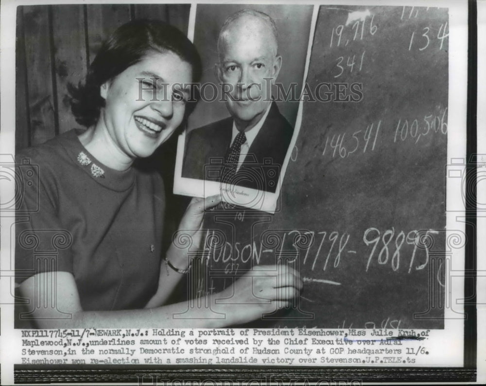 1956 Press Photo Newark NJ Julie Kruh & portrait of Pres Eisenhower