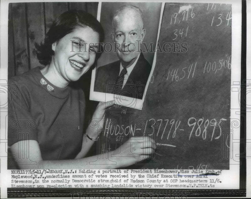 Load image into Gallery viewer, 1956 Press Photo Newark NJ Julie Kruh &amp; portrait of Pres Eisenhower

