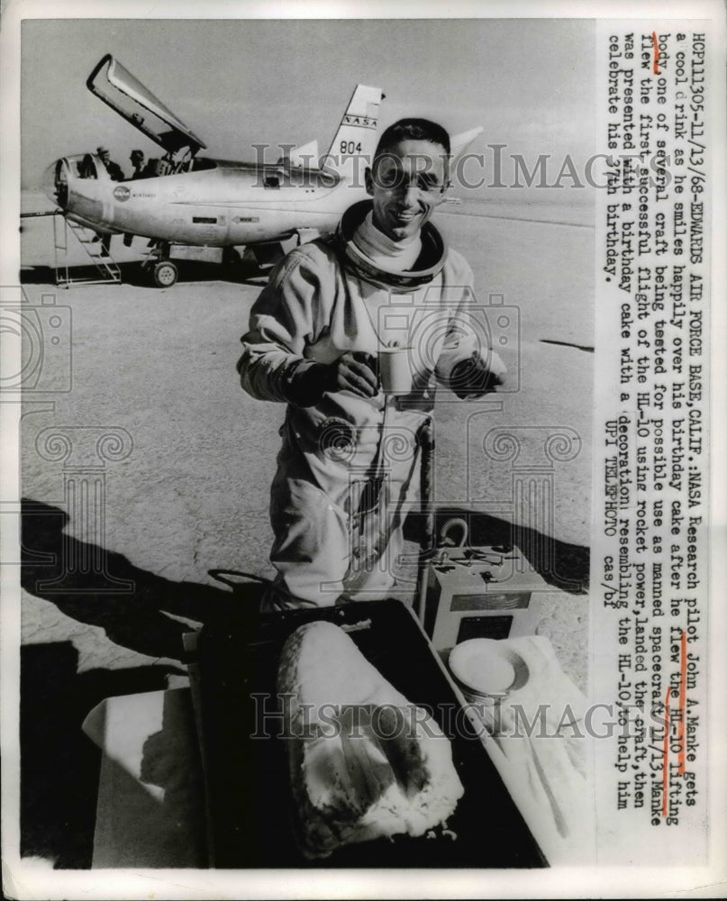 1968 Press Photo Pilot John A Manke gets drink after flying Hi-Lo lifting body