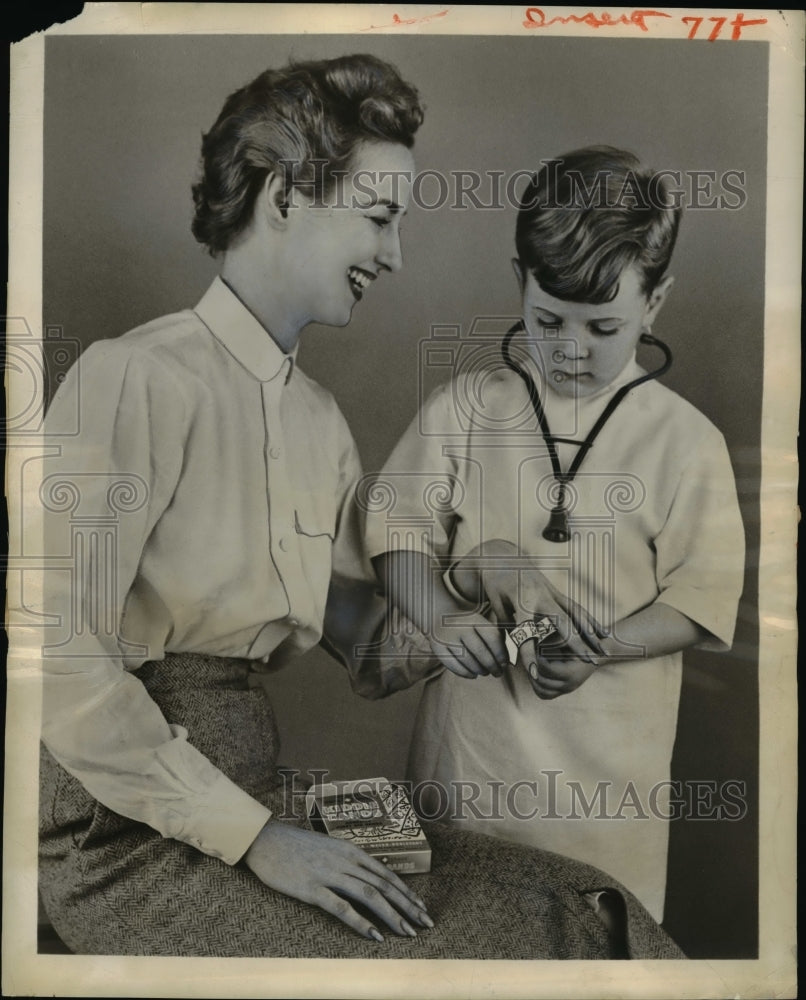 1956 Press Photo Adhesive Bandage Bandaid with Playtime Pictures for Children- Historic Images