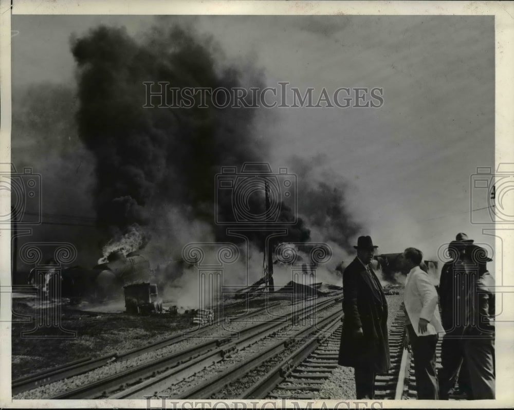 1942 Press Photo Overturned oil tank cars in flames after collision of train