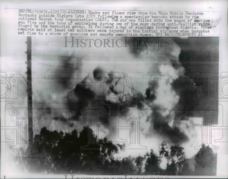 Load image into Gallery viewer, 1962 Press Photo Smoke and Flame from the Main Mobile Gendarme Barracks
