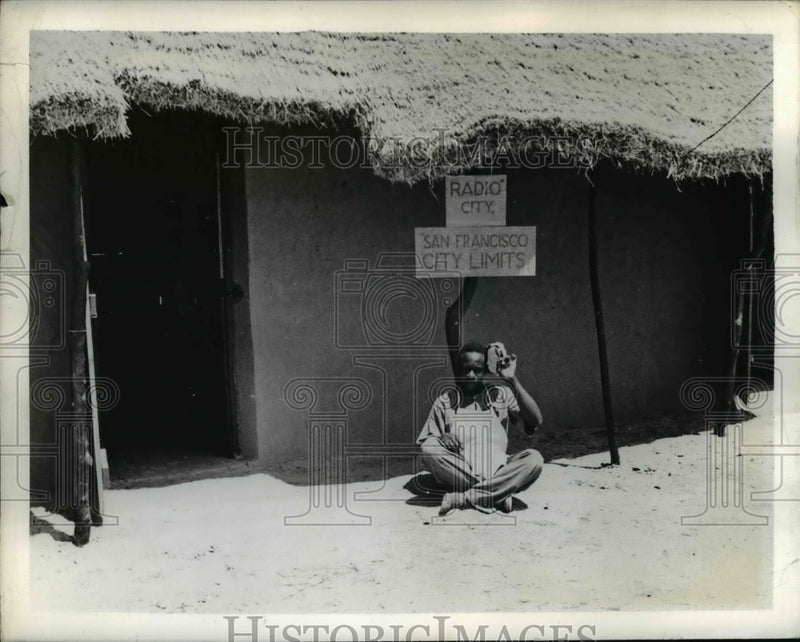 Load image into Gallery viewer, 1942 Press Photo Native at co-op somewhere in Africa
