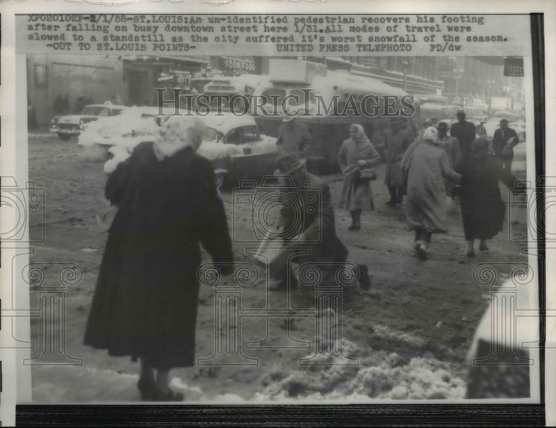Load image into Gallery viewer, 1958 Press Photo St Louis Missouri Pedestrian Regains Footing After Fall on Snow
