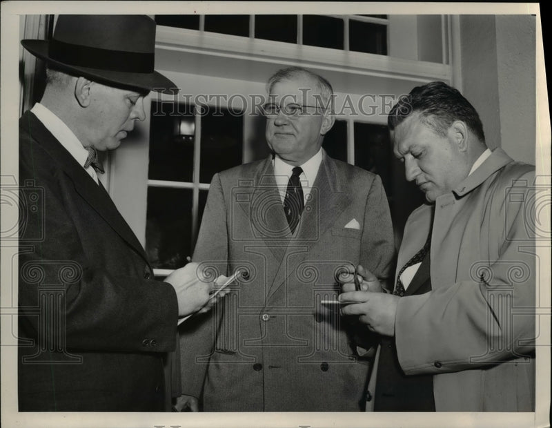 Load image into Gallery viewer, 1953 Press Photo of H.J. Porter (C) being interviewed after a meeting with the

